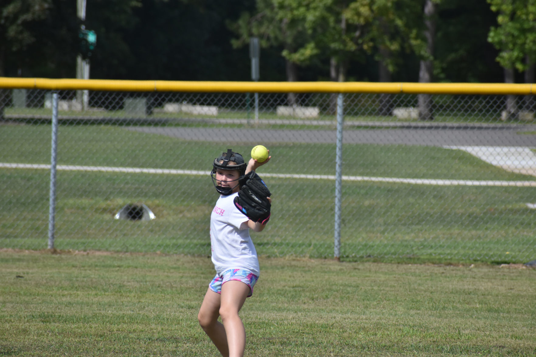 Throwing softball to teammate